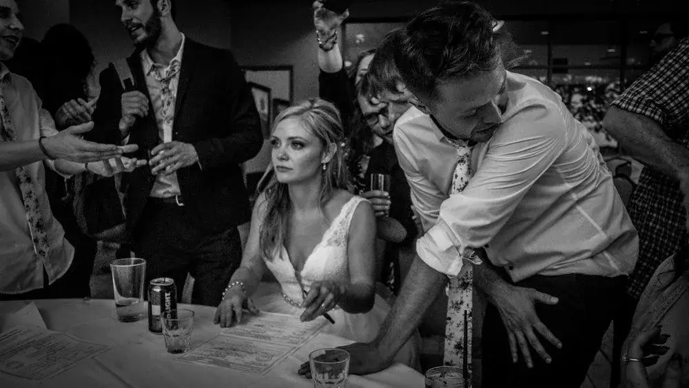Black-and-white wedding reception moment in Idaho, photo by Rusty Rehl