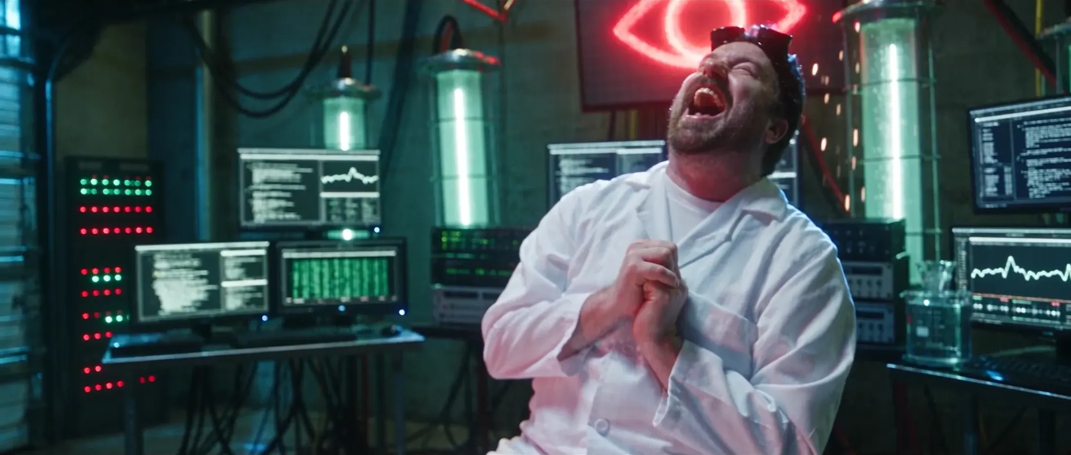 Mad scientist throwing his head back in laughter beneath a red neon eye, still from Rusty Rehl's ad for Combat Sport Supply