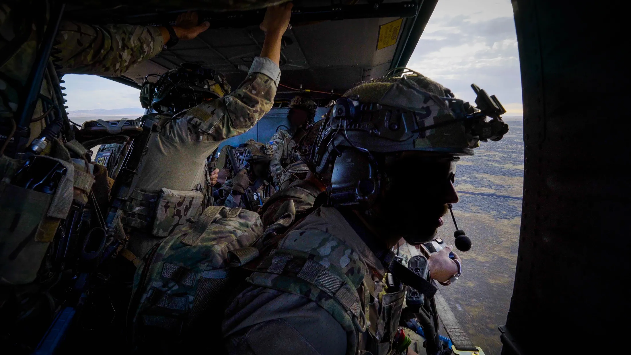 FBI agents ride in an Idaho Army National Guard UH-60 Black Hawk over the desert during Exercise Hellgate, photo by Rusty Rehl