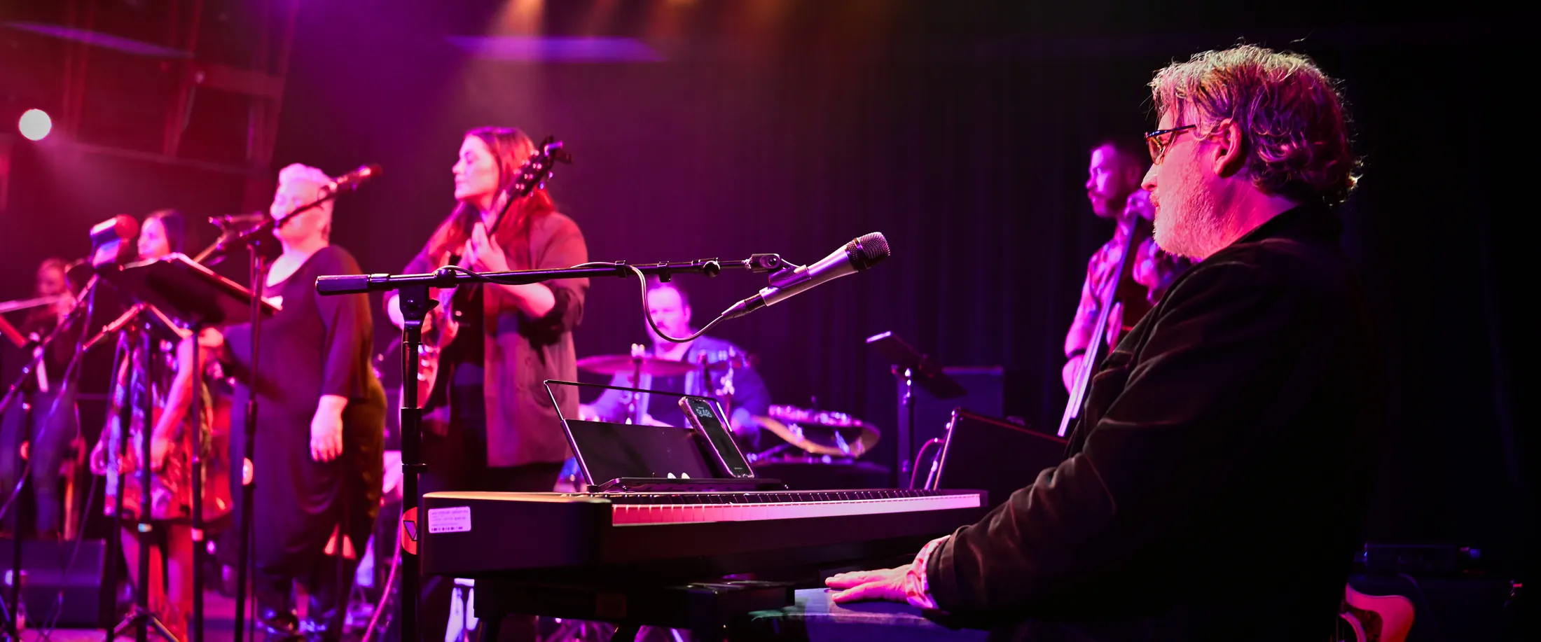 Wide view of the Visual Arts Collective stage with Martin Daniels at the keyboard in the foreground, Boise, Idaho concert photo by Rusty Rehl