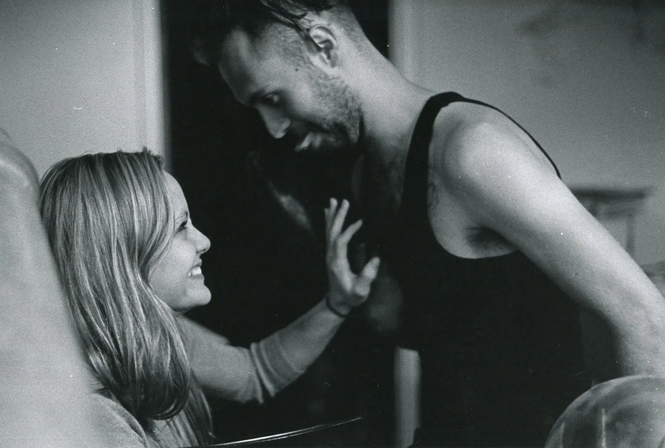 Quinn and Gabby laughing together in black and white, candid couples photo by Boise, Idaho photographer Rusty Rehl