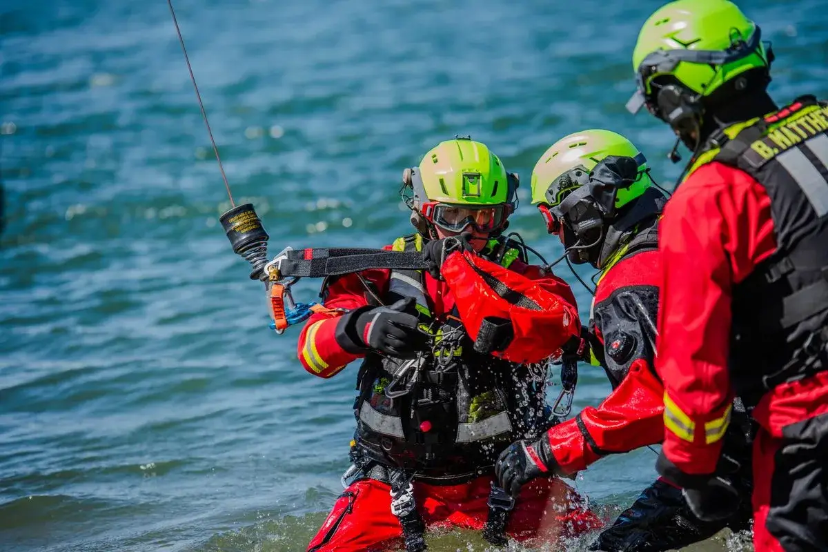 Rescue swimmers work in the water during Idaho National Guard helicopter hoist training, photo by Rusty Rehl